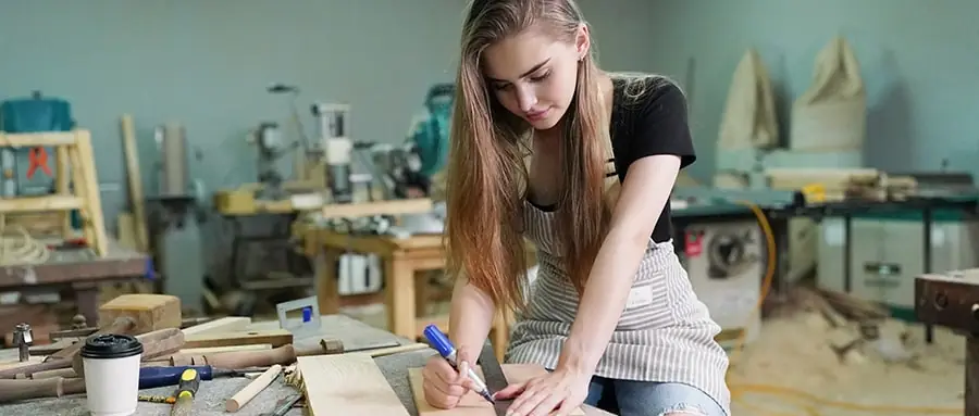 Young woman working on a carpentry project
