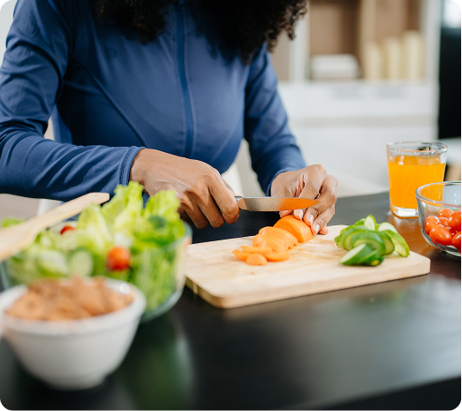 Preparing a healthy salad on a kitchen counter.