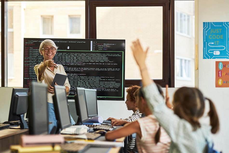 Teacher calling on a student in a coding class